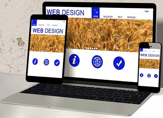 Small business website design showing professional mobile-friendly website on laptop and smartphone